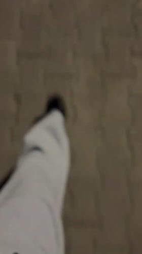 Person walks on S-shaped concrete pavement in Boreti