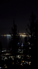Nighttime cityscape captured in Fethiye, Turkey with water reflections
