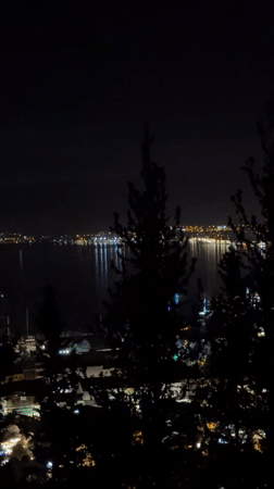 Nighttime cityscape captured in Fethiye, Turkey with water reflections