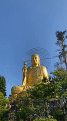Golden Buddha statue documented in Đà Lạt, Vietnam
