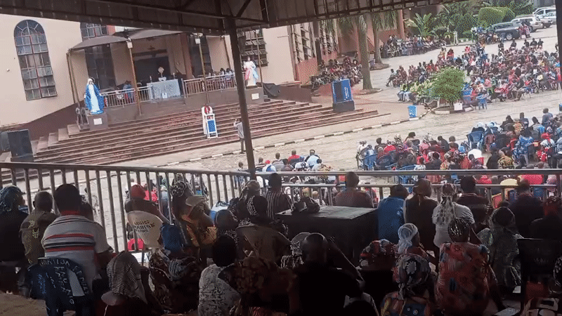 Large outdoor religious gathering at Onitsha church, Nigeria