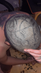 Tattooed individuals share haircut moment in Herceg Novi