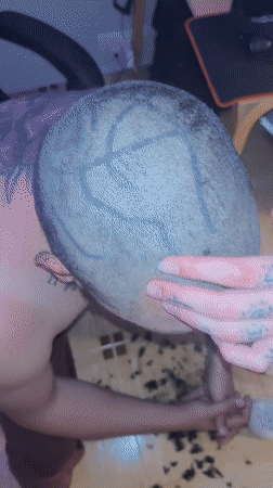 Tattooed individuals share haircut moment in Herceg Novi