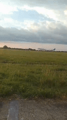 Aircraft departs Orerokpe runway during sunset