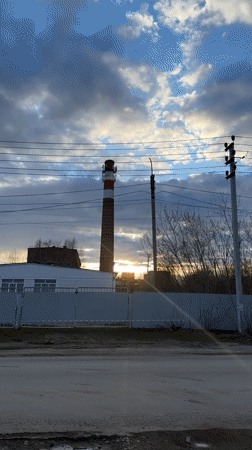 Young person documents daytime moon, industrial scenes in Chernushka