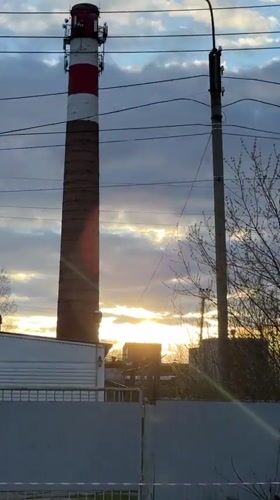 Young person documents daytime moon, industrial scenes in Chernushka