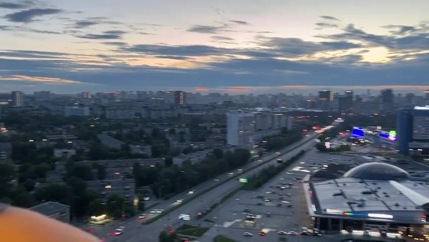 Yekaterinburg at dusk, seen from the ground and the air