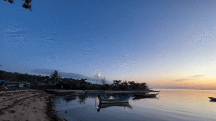 Dusk settles over moored fishing boats on Ko Pha-ngan's coast