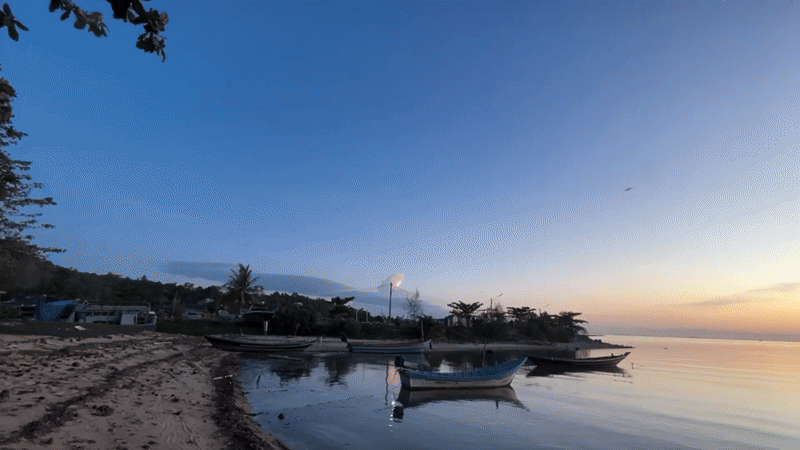 Dusk settles over moored fishing boats on Ko Pha-ngan's coast