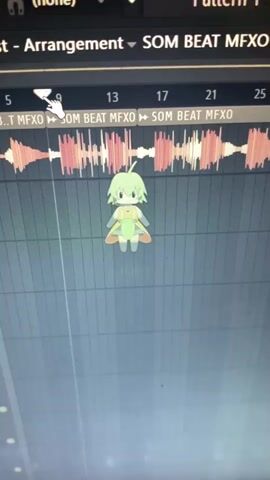 The video displays a computer screen showing a Digital Audio Workstation (DAW) interface, likely FL Studio. An animated, anime-style character with green hair and a yellow-green outfit is dancing on the screen, synchronized with music being played through the DAW. The character is positioned centrally below the audio waveforms. A white mouse cursor, shaped like a hand, is visible interacting with the DAW's timeline, indicating user activity.

The primary activity is music playback and apparent interaction with music production software. The character's dance movements are fluid and aligned with the rhythmic elements of the audio. The screen shows detailed audio waveforms in shades of red and white, sprawling across the timeline. The grid background of the DAW is visible, and the overall impression is one of creative work or enjoyment of digital music. While the external context points to Ibadan, Nigeria, there are no specific visual cues within the video itself to indicate this location.

Visible text on the screen includes "Playlist - Arrangement," "(none)," "Pattern 1," and "SOM BEAT MFXO" repeated several times, which likely denotes an audio track or pattern name. Timeline markers are numbered "5," "9," "13," "17," "21," and "25." The audio features an electronic beat with what sounds like vocal snippets, to which the character dances energetically.