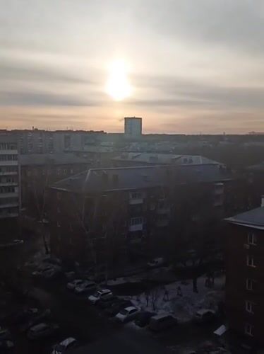 Early morning scenes captured in snowy Novosibirsk residential area