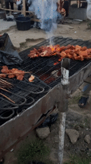 Open-air suya grilling on Rukuba Road, Nigeria