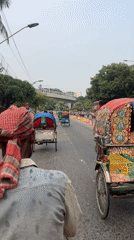 Cycle rickshaws navigate Dhaka streets in routine transport
