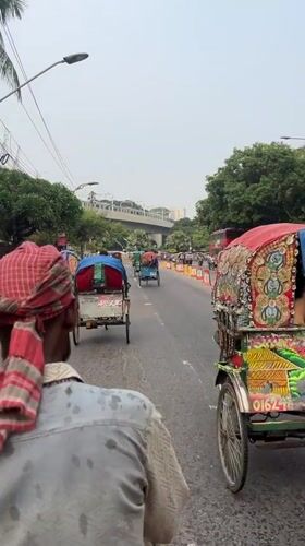 Cycle rickshaws navigate Dhaka streets in routine transport
