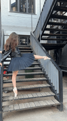Ballet en pointe on a Moscow outdoor staircase