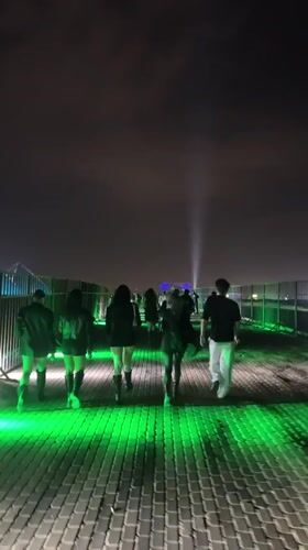 Nighttime gathering draws crowds to illuminated structures in Giza