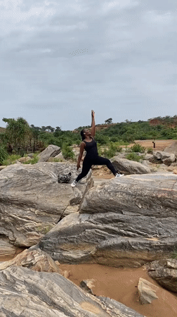 Tourists explore rocky formations and water pools in Ganawuri