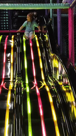 Child enjoys playground activities at Krasnodar indoor recreation facility