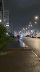 Nighttime pedestrian activity on wet Saint Petersburg streets