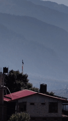 Helicopters over Vashisht as Himalayan clouds roll through