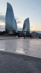 Witness documents Baku cityscape and Flame Towers at dusk