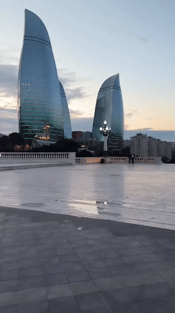 Witness documents Baku cityscape and Flame Towers at dusk