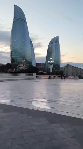 Witness documents Baku cityscape and Flame Towers at dusk