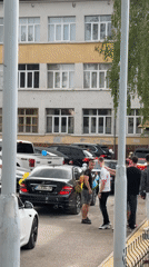 Balloon-decorated luxury cars gather for celebration at Bulgarian school