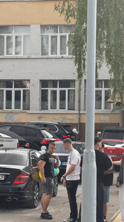 Balloon-decorated luxury cars gather for celebration at Bulgarian school