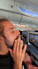 Passenger eats with eyes closed aboard aircraft near Kathmandu