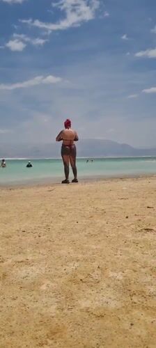 Beachgoers engage in mud bathing at Israeli Dead Sea area