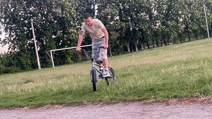 Afternoon recreation: BMX tricks and soccer on community field