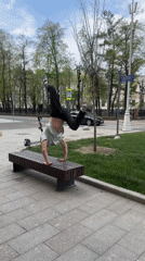 Man performs handstands on park benches in Moscow