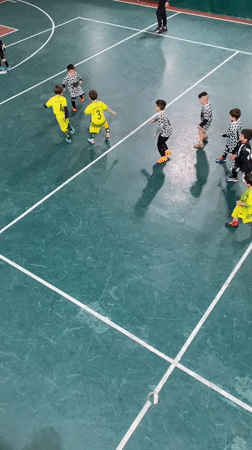Youth soccer teams play indoor match in Wilde, Argentina