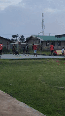 Pickup volleyball at dusk in Narayi, Nigeria