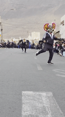 Evening parade with costumed dancers in Iquique streets