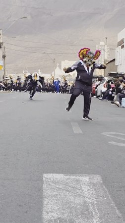 Evening parade with costumed dancers in Iquique streets