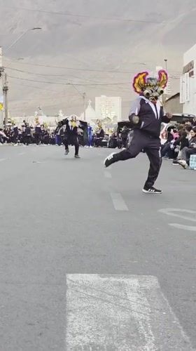 Evening parade with costumed dancers in Iquique streets