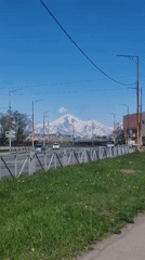 Woman documents sunny morning walk in Petropavlovsk-Kamchatsky, Russia