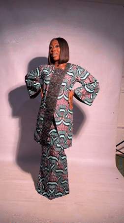 Woman in traditional dress photographed smiling in Jos, Nigeria