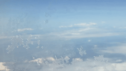 Aerial view captures snow-covered mountains over North Macedonia