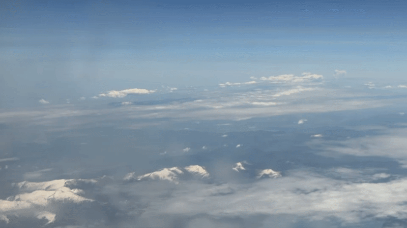 Aerial view captures snow-covered mountains over North Macedonia