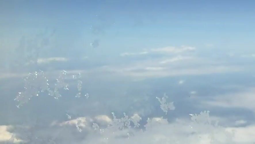 Aerial view captures snow-covered mountains over North Macedonia