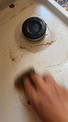 Dirty stovetop with greasy residue documented in Milan
