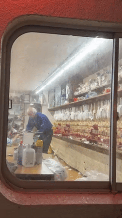 Tourist documents nighttime stroll through traditional Yamanouchi hot spring district
