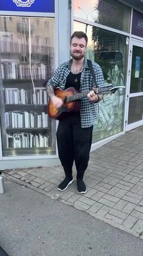 Acoustic busking session on a Minsk sidewalk