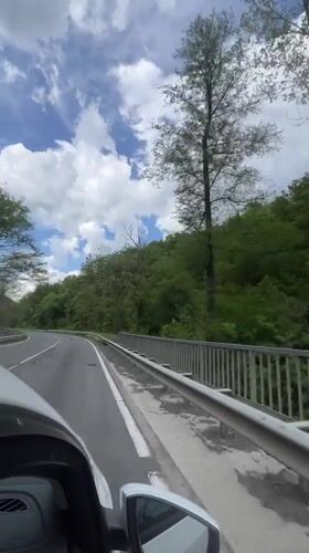 Driver records roadside scenery from moving car in Kamchia