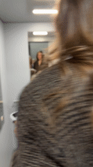Two women take selfies in Belgrade elevator and changing room