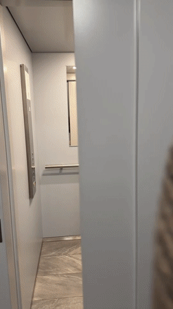 Two women take selfies in Belgrade elevator and changing room