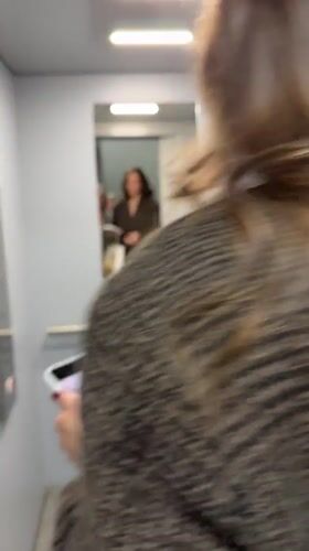 Two women take selfies in Belgrade elevator and changing room